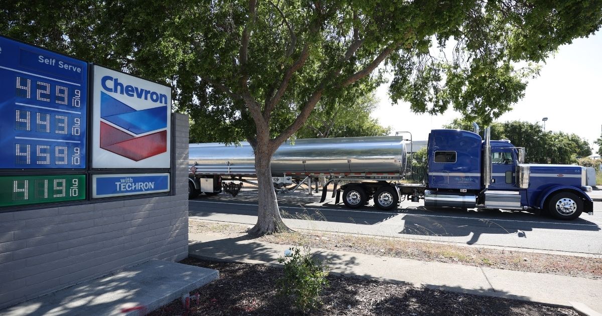 A fuel truck drives by a Chevron gas station on April 29, 2021, in Richmond, California.