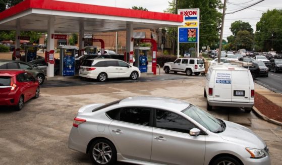 Motorists line up at an Exxon station selling gas at $3.29 per gallon soon after it's fuel supply was replenished in Charlotte, North Carolina, on May 12, 2021.