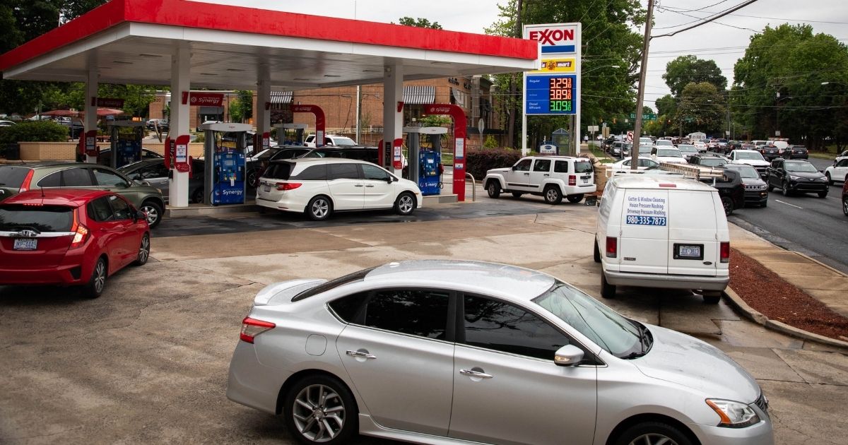 Motorists line up at an Exxon station selling gas at $3.29 per gallon soon after it's fuel supply was replenished in Charlotte, North Carolina, on May 12, 2021.