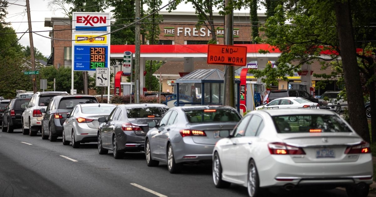 Motorists line up at an Exxon station selling gas at $3.29 per gallon soon after it's fuel supply was replenished in Charlotte, North Carolina, on Wednesday.