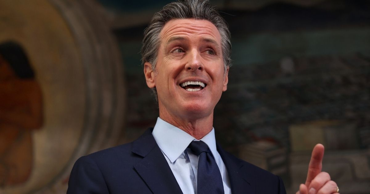 California Gov. Gavin Newsom speaks during a news conference at the Unity Council in Oakland on May 10.