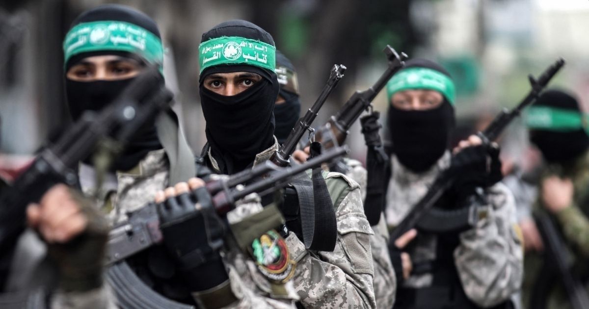 Fighters from the Ezzedine al-Qassam Brigades, the armed wing of the Palestinian Hamas movement, take part in a military show ahead of the 30th anniversary of the movement's founding in the southern Gaza Strip city of Khan Yunis on Dec. 5, 2017.