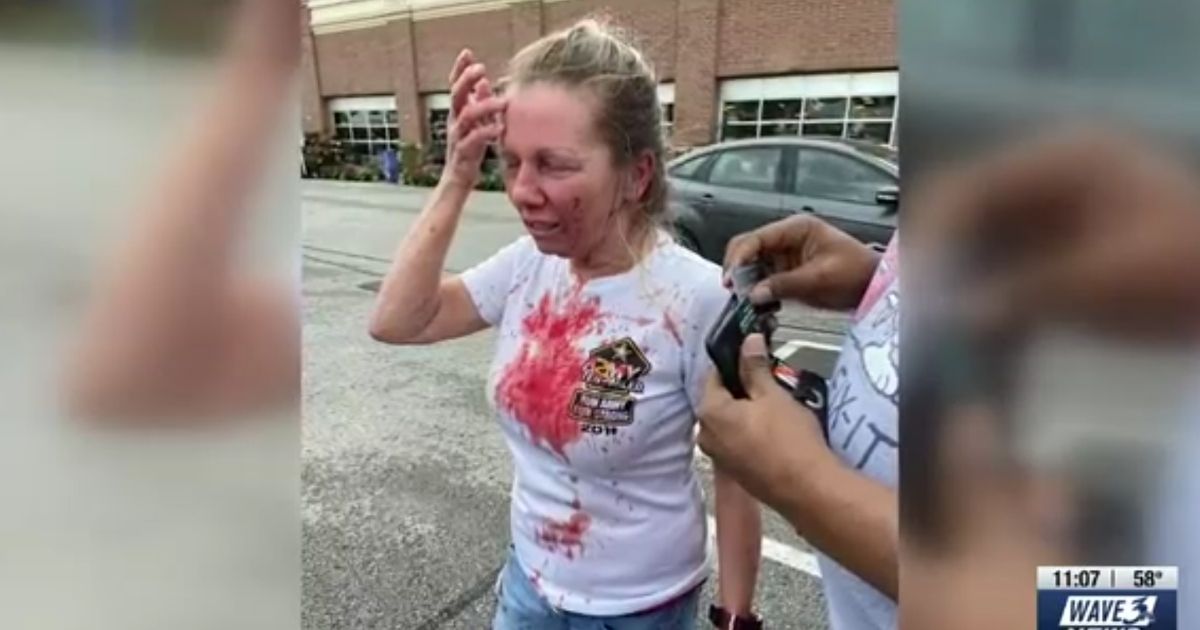Pamela Ahlstedt-Brown stands in a Louisville, Kentucky, parking lot after allegedly being assaulted.