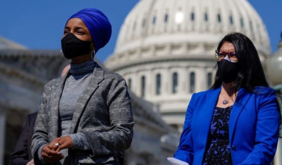 Democratic Reps. Ilhan Omar of Minnesota and Rashida Tlaib of Michigan attend a news conference to discuss proposed legislation outside the U.S. Capitol on March 11, 2021 in Washington, D.C.