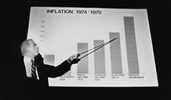 Boston Mayor Kevin White points to a chart showing inflation in different categories on Sept. 25, 1978.