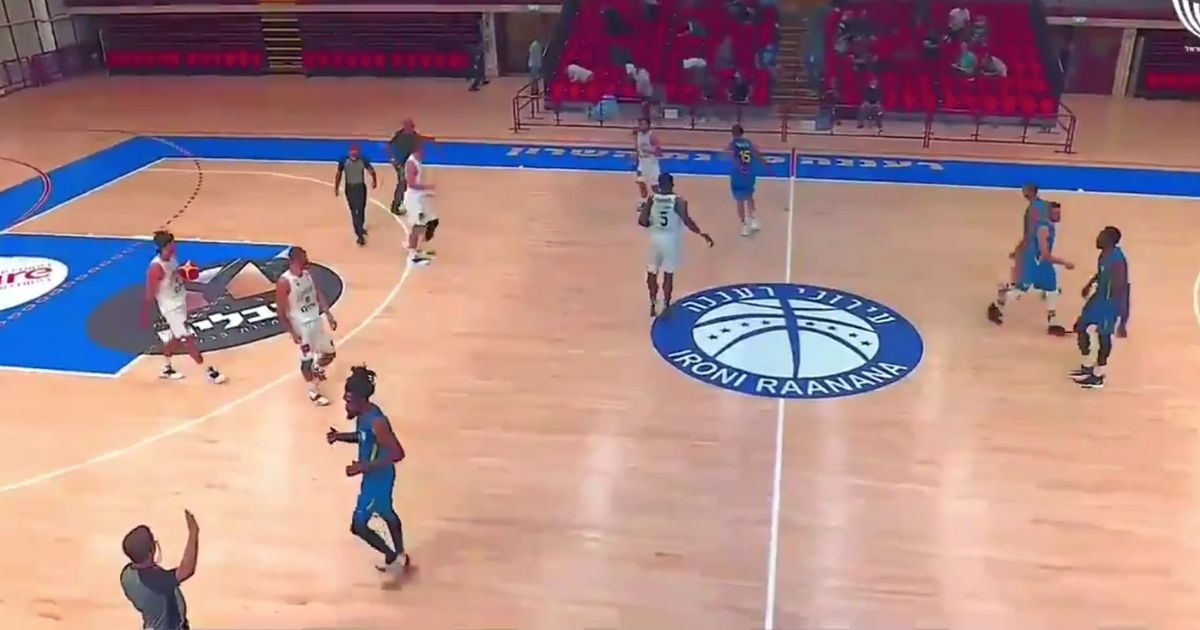 Basketball players in Central Israel were forced to stop their game and drop to the floor on Tuesday, as sirens alerted to incoming air attacks.