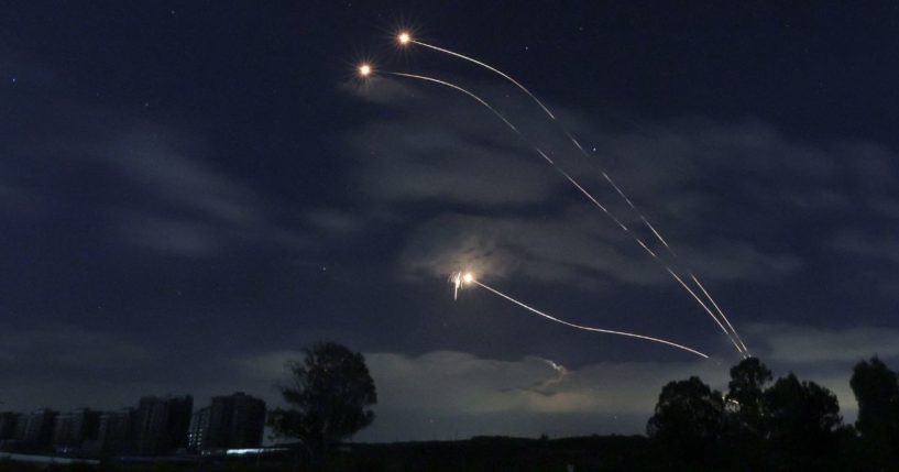 This picture taken from Sderot in southern Israel on the border with the Gaza Strip shows rockets fired from Israel's Iron Dome missile defense system on Thursday.