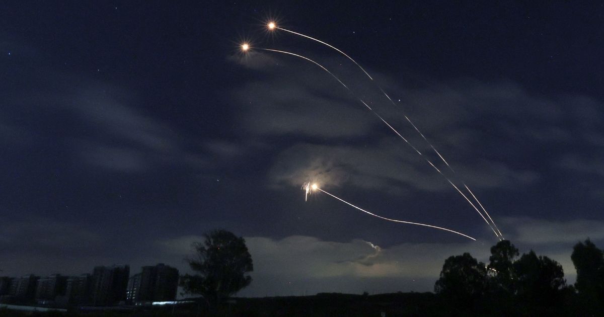 This picture taken from Sderot in southern Israel on the border with the Gaza Strip shows rockets fired from Israel's Iron Dome missile defense system on Thursday.