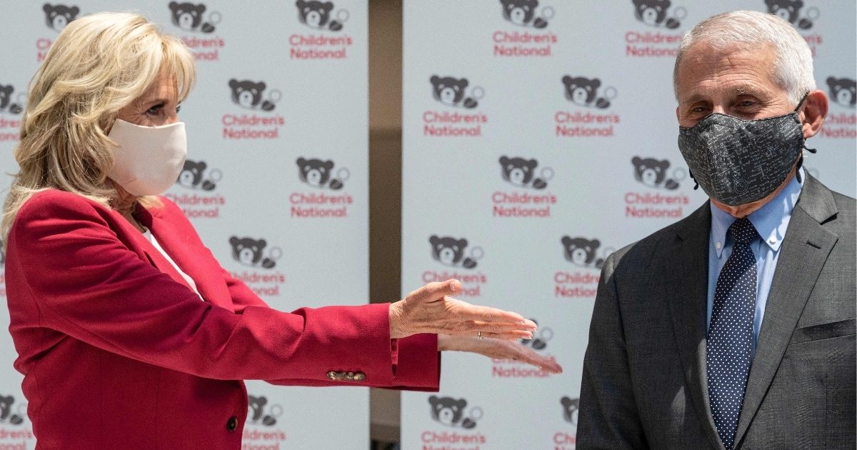 First lady Jill Biden, left, and Dr. Anthony Fauci, right, tour the vaccination center at the Children's National Hospital in Washington, D.C., on Thursday.
