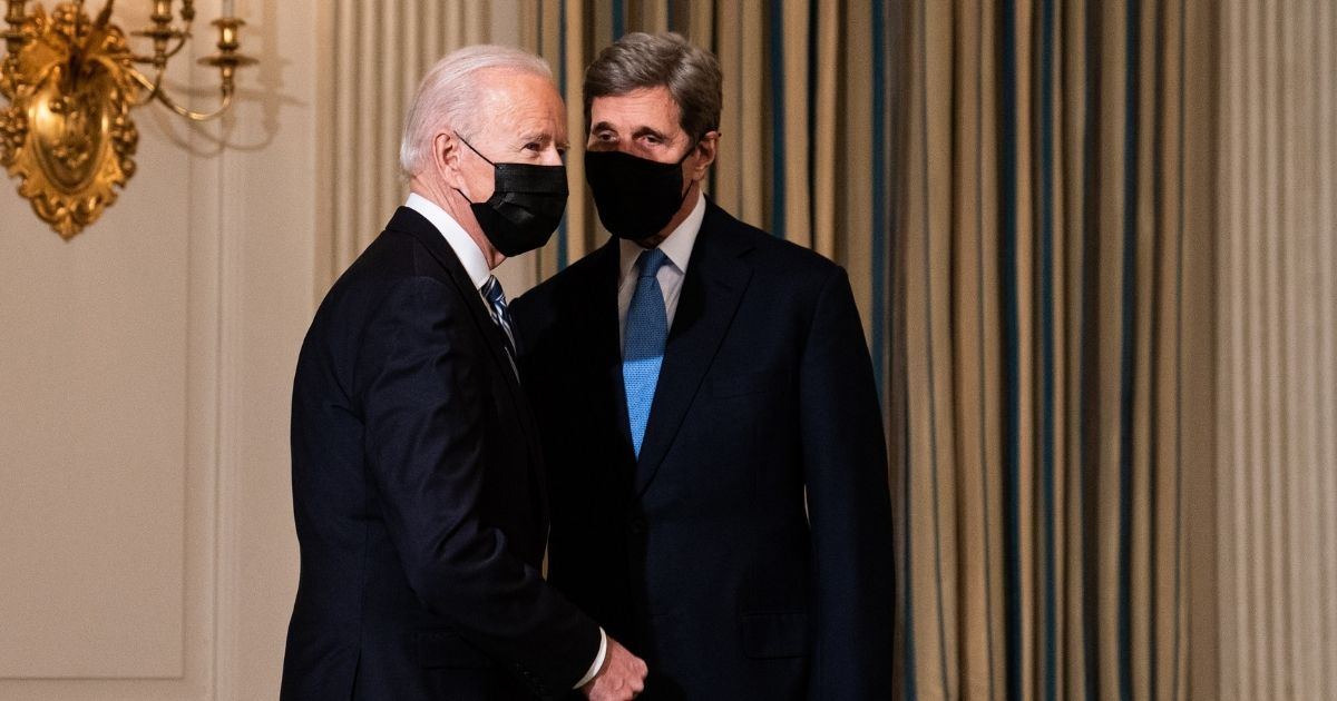 President Joe Biden greets Special Presidential Envoy for Climate John Kerry as he arrives to speak about climate change issues in the State Dining Room of the White House on Jan. 27, 2021, in Washington, D.C.