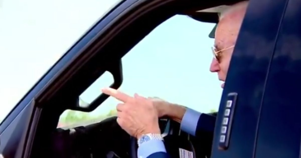 President Joe Biden jokingly threatened to run over a reporter who attempted to ask him about the tense situation in Israel on Tuesday as he test-drove a Ford truck in Michigan.