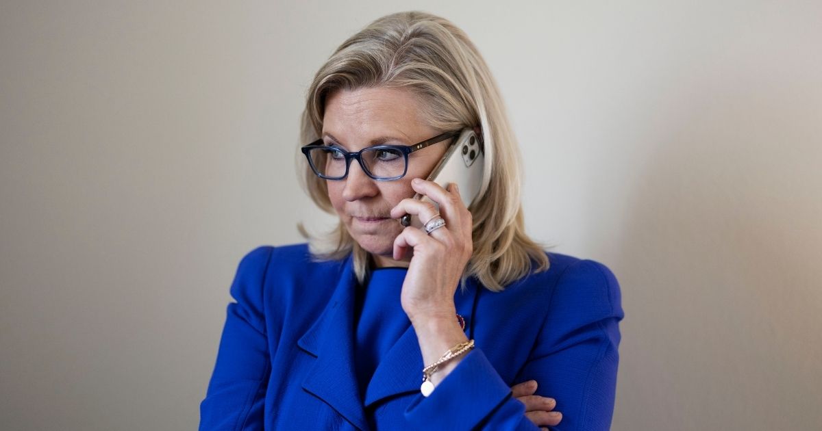 Republican Rep. Liz Cheney of Wyoming is seen on the phone in her office after losing her GOP leadership role.