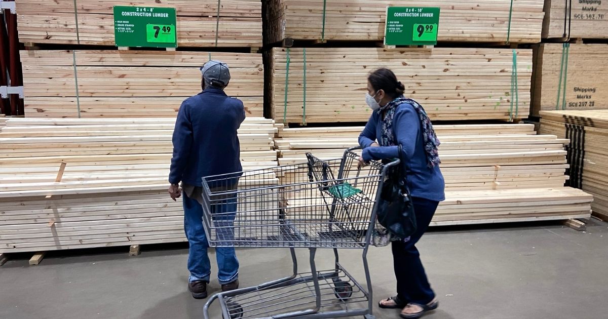 Customers look at stacks of lumber at a home center in Chicago on April 5.