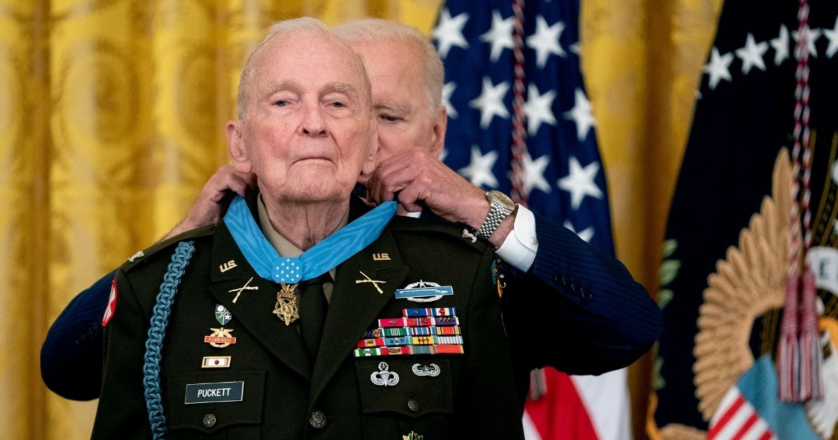 President Joe Biden presents the Medal of Honor to retired Army Col. Ralph Puckett in the East Room of the White House on Friday in Washington, D.C.