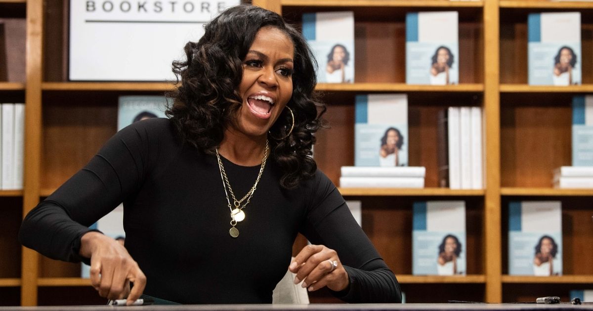 Former U.S. first lady Michelle Obama appears at a book signing on the first anniversary of the launch of her memoir "Becoming" at the Politics and Prose bookstore in Washington, D.C., on Nov. 18, 2019.