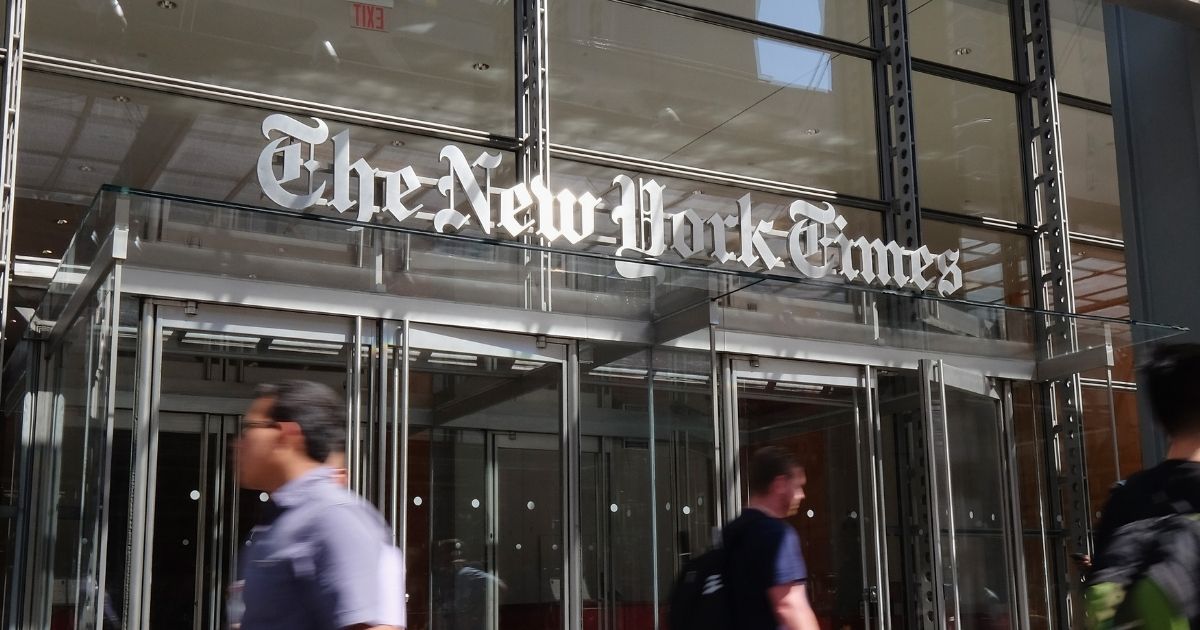 Pedestrians walk by The New York Times building on June 30, 2016, in New York City.