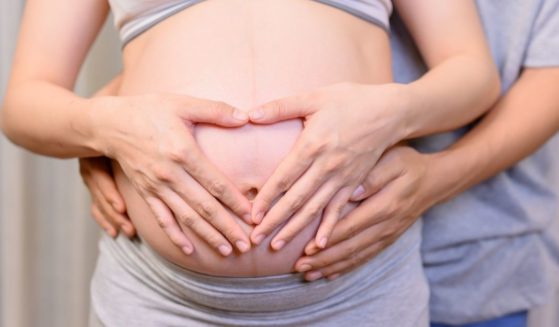 A pregnant mother is pictured in the stock image above.