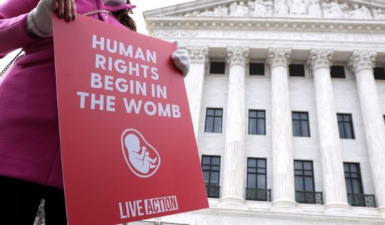 A pro-life activist holds a sign outside the U.S. Supreme Court during the 48th annual March for Life Jan. 29 in Washington, D.C.
