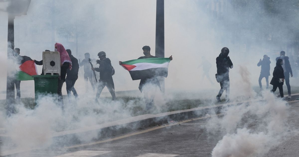 Smoke fills the air as pro-Palestinian demonstrators riot in Paris on May 15, 2021.