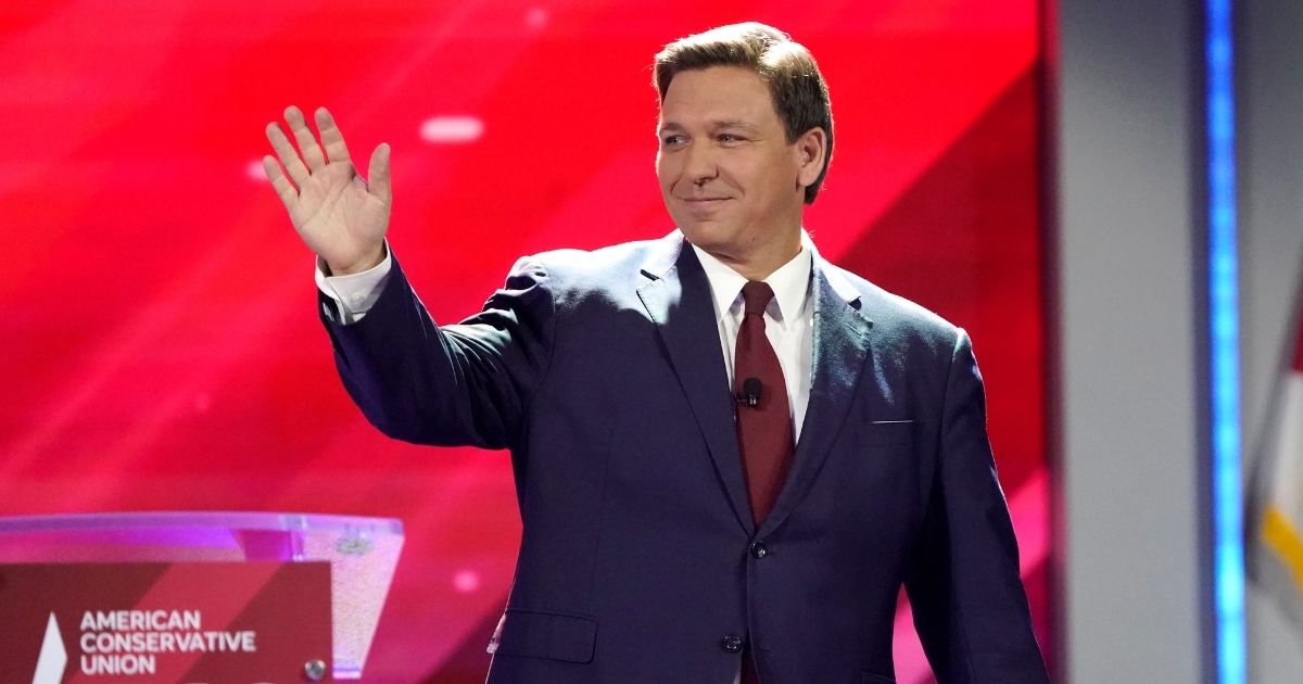 Republican Florida Gov. Ron DeSantis waves to supporters at the Conservative Political Action Conference (CPAC) on Feb. 26, 2021, in Orlando.