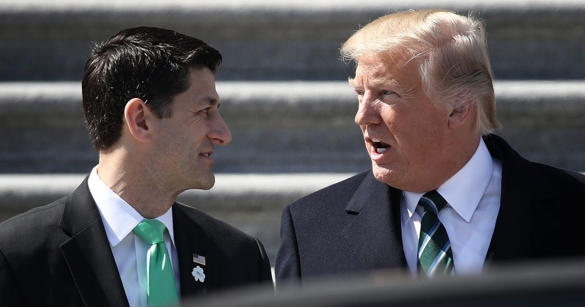 Then-President Donald Trump talks to then-House Speaker Paul Ryan following a luncheon celebrating St. Patrick's Day at the U.S. Capitol on March 16, 2017.