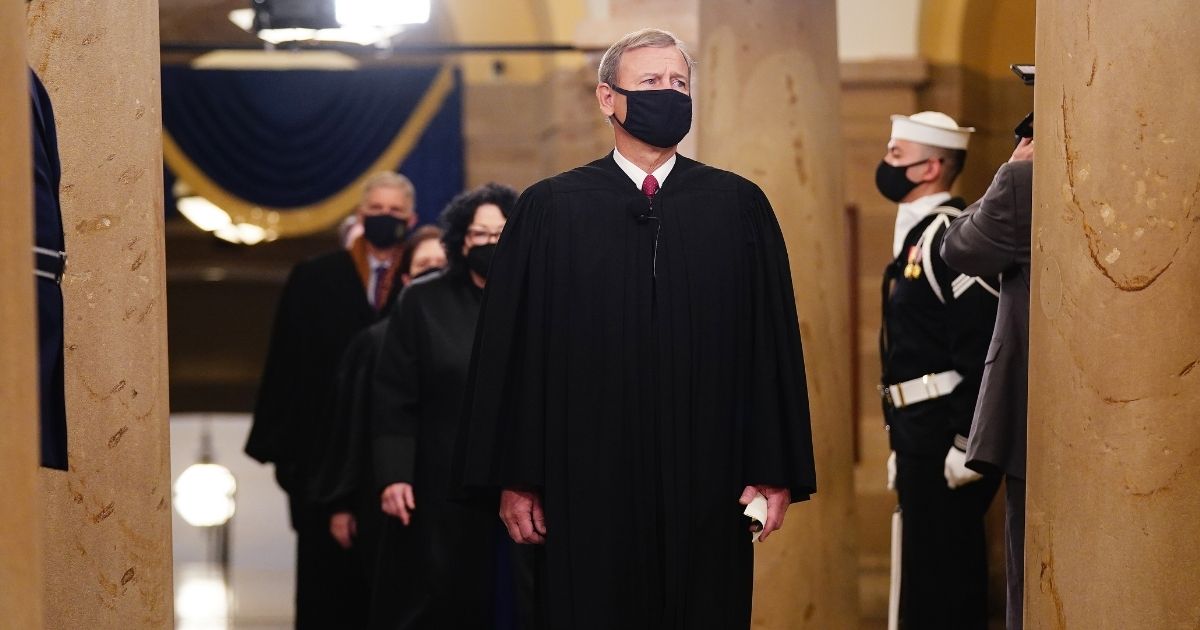 Chief Justice John Roberts leads the U.S. Supreme Court justices as they arrive in the Crypt of the U.S. Capitol for President Joe Biden's inauguration ceremony on Jan. 20, 2021, in Washington, D.C.