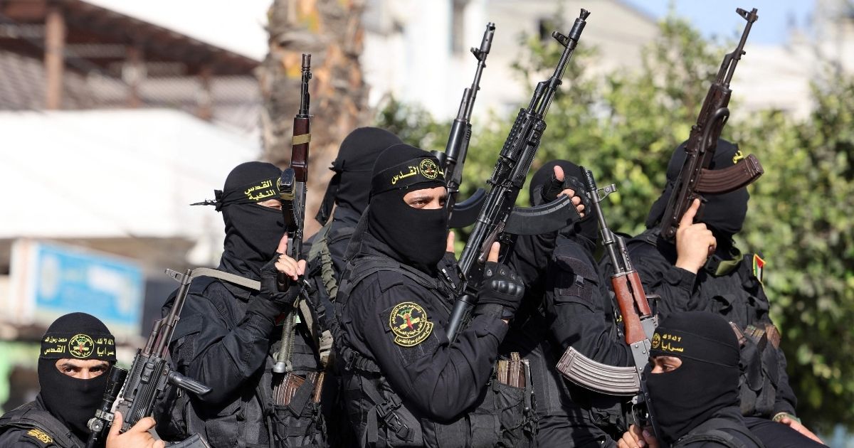 Fighters with the Saraya al-Quds Brigades, the armed wing of Palestinian Islamic Jihad, parade with their weapons in the streets of Gaza City during a rally on Saturday, more than a week after a ceasefire brought an end to 11 days of hostilities between Israel and Hamas.