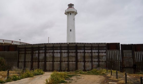 The Faro de Playas de Tijuana lighthouse stands behind the border wall where it ends in the Pacific Ocean along the U.S.-Mexico border between San Diego and Tijuana on Monday at International Friendship Park in San Diego County, California.