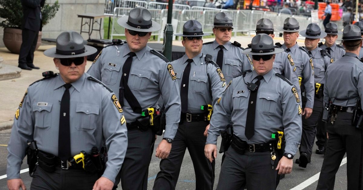 Pennsylvania State Troopers arrive outside Cathedral Basilica of Saints Peter and Paul before the arrival of Pope Francis on Sept. 26, 2015, in Philadelphia, Pennsylvania.