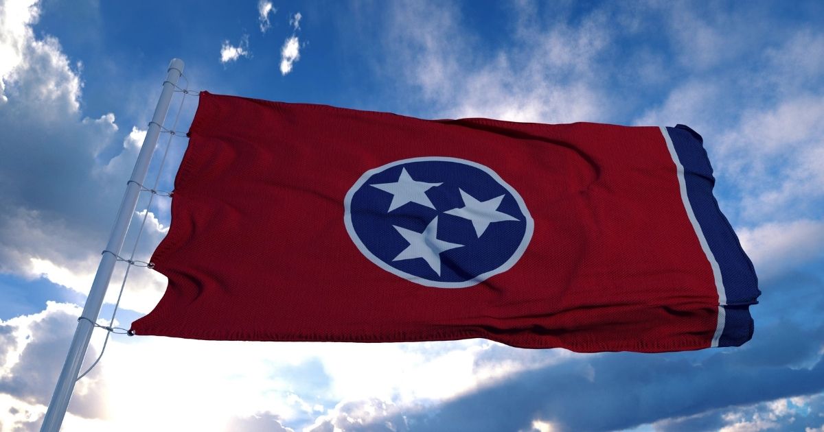 The Tennessee state flag flies in the above stock image.