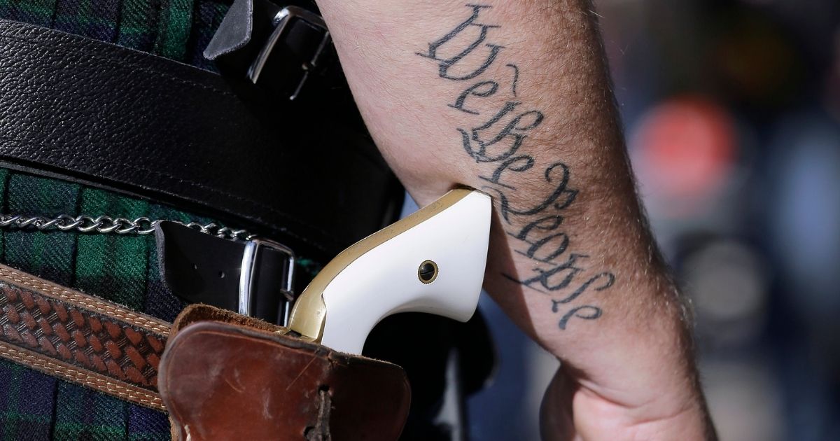 A man wears a pistol during a rally in support of open carry gun laws at the state Capitol in Austin, Texas, on Jan. 26, 2015.