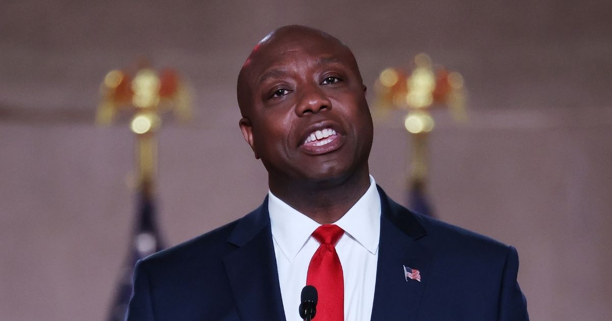 Republican Sen. Tim Scott of South Carolina stands on stage in an empty Mellon Auditorium while addressing the Republican National Convention on Aug. 24, 2020, in Washington, D.C.