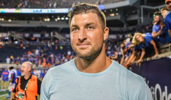 Former University of Florida football star Tim Tebow attends a game between the Gators and the Miami Hurricanes at Camping World Stadium in Orlando, Florida, on Aug. 24, 2019.