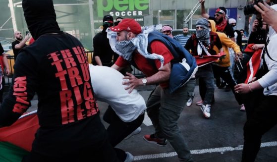 Pro-Palestinian protesters face off with a group of Israel supporters and police in a violent clash in Times Square on May 20 in New York City.