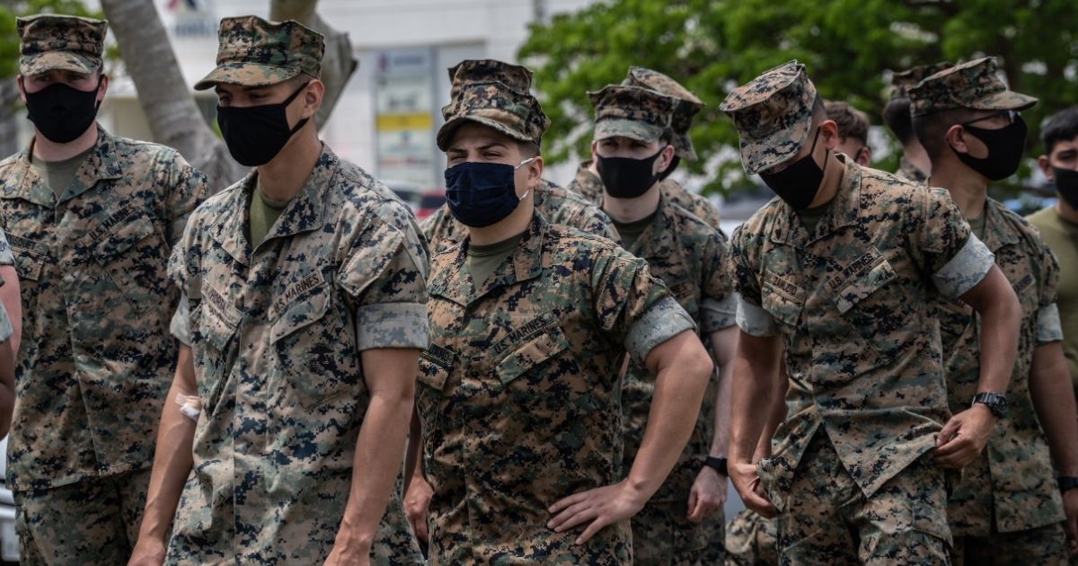 U.S. Marines prepare to receive the Moderna coronavirus vaccine at Camp Hansen in Okinawa, Japan, on April 28, 2021.