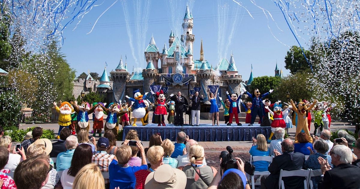 A Disney handout photo shows employees and customers celebrating the 60th anniversary of Disneyland in Anaheim, California, in 2015.