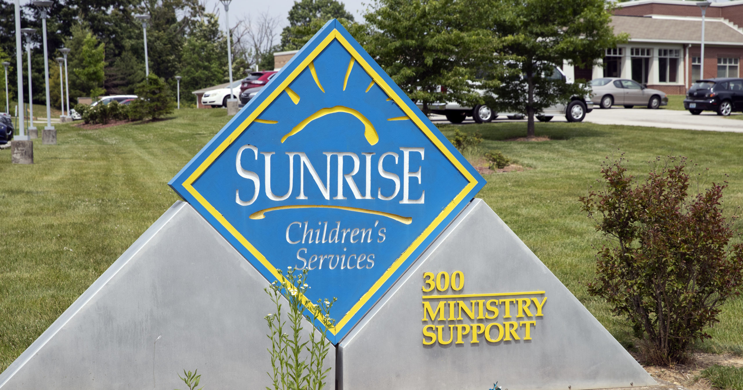 A sign for Sunrise Children's Services sits in front of the agency's Mount Washington, Kentucky, location on Wednesday.