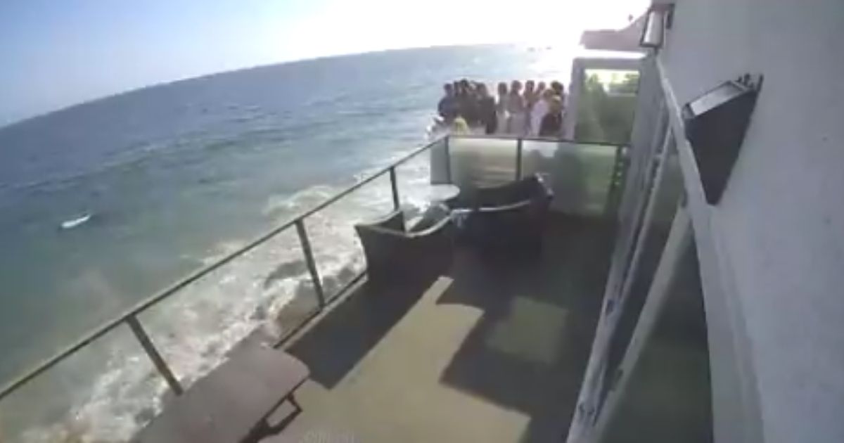 A stunning video shows the moment a packed balcony at a Southern California party collapsed this past weekend and sent more than a dozen people plunging to the rocky ground below.