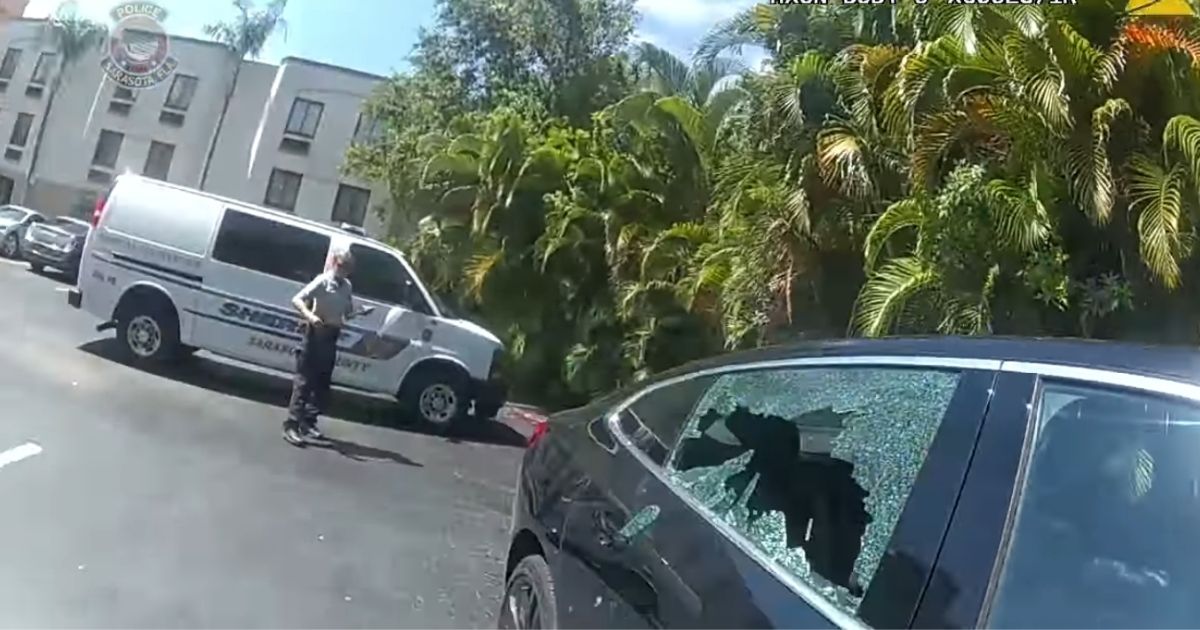 Officers break the window of a parked car in Florida to get some air to a dog that was locked inside.