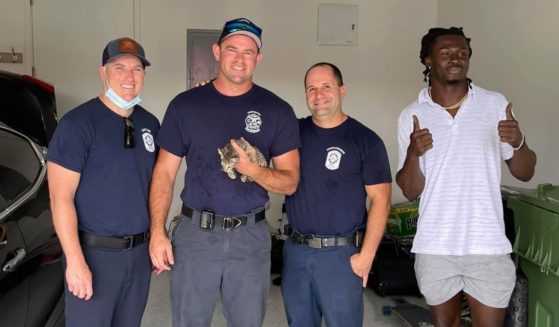 The three firefighters who rescued the kitten that NFL player Isaac Yiadom discovered stuck under his Maserati.