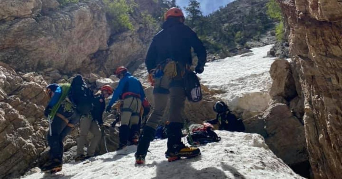 The Salt Lake County Sheriff's Office Search and Rescue team retrieves the body of a climber who died after falling around 100 feet on Mount Olympus.