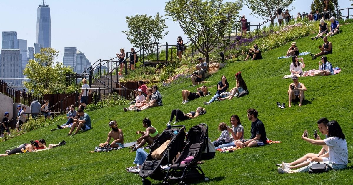 People visit Hudson River Park on Friday in New York City.