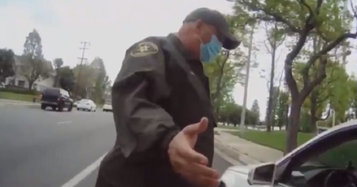 A Los Angeles County Sheriff's Office supervisor talks to a motorist during a traffic stop recorded on a deputy's personal body camera.