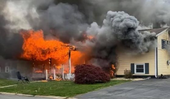 A house goes up in flames after a resident with reported mental health issues allegedly set it on fire and watched it burn from a lawn chair set up outside.