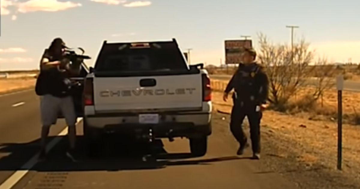 A suspect fires on a New Mexico State Police officer.