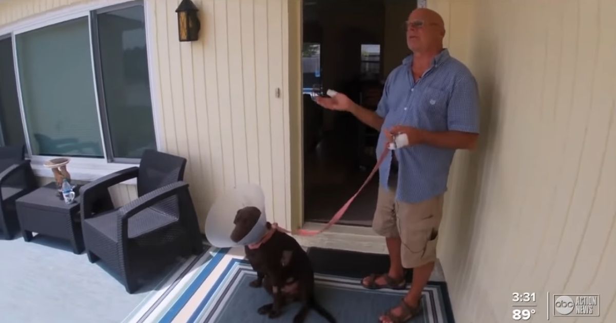 Mike McCoy and his dog, Jake. Jake was attacked by an alligator, but McCoy fought until the reptile let his dog go.
