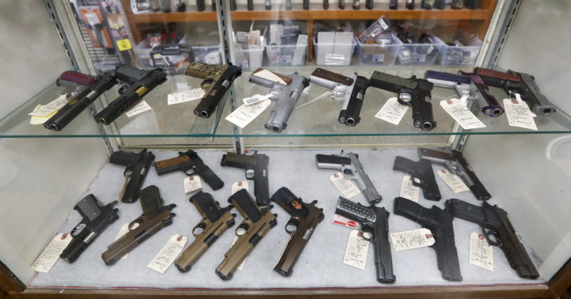 Semi-automatic handguns are displayed at a shop in New Castle, Pennsylvania, on March 25, 2020.