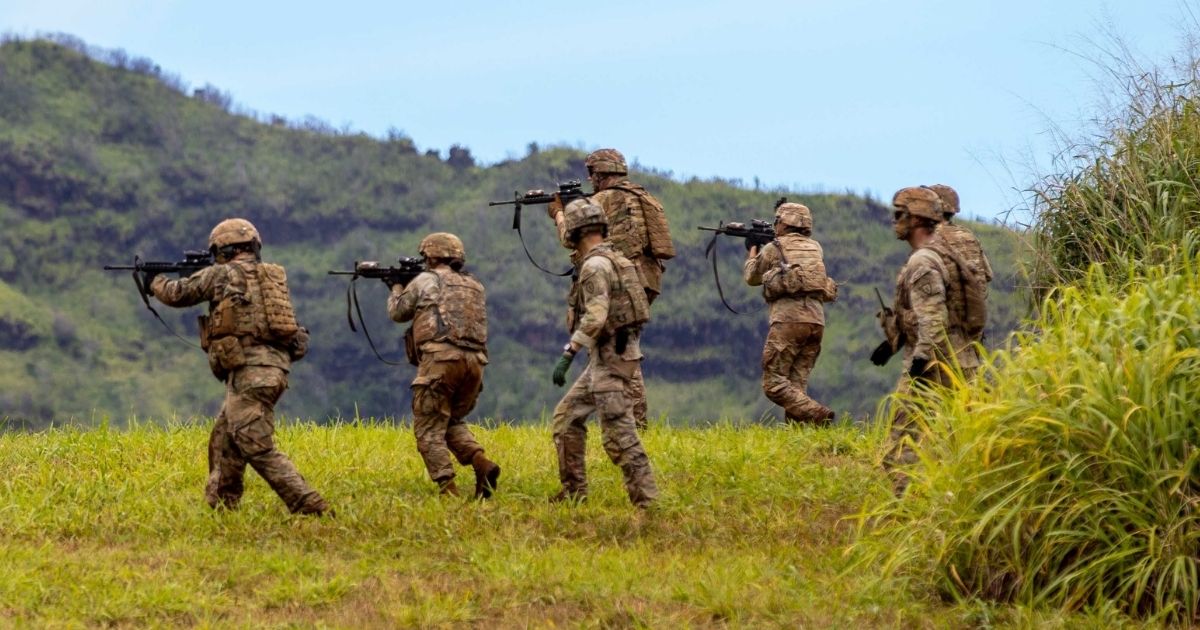 Soldiers assigned to A Company, 29th Brigade Engineer Battalion, 3rd Infantry Brigade Combat Team, 25th Infantry Division conduct squad live fire exercise training at Schofield Barracks in Hawaii on March 30.