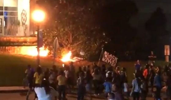 Protesters set fires outside the Rock Hill, South Carolina, police station.