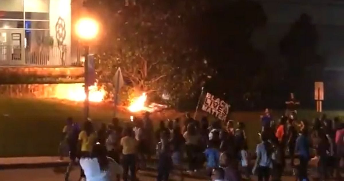Protesters set fires outside the Rock Hill, South Carolina, police station.